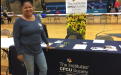 Anita showing CPCU table at CHS Career Fair